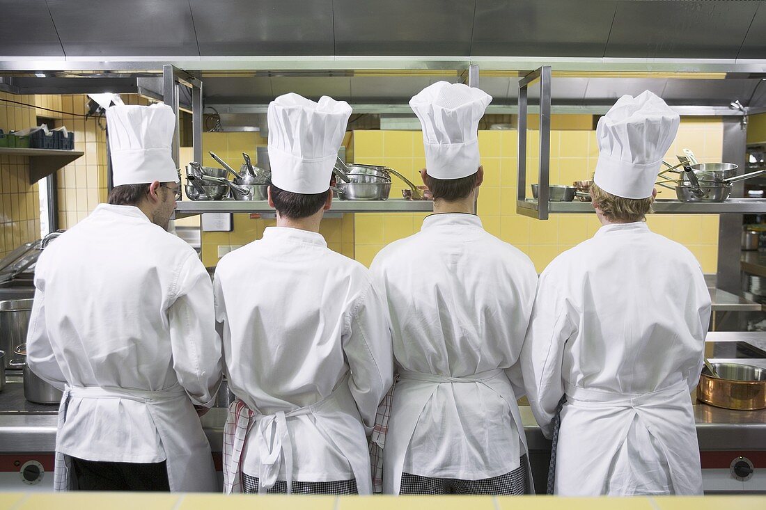 Four chefs from behind