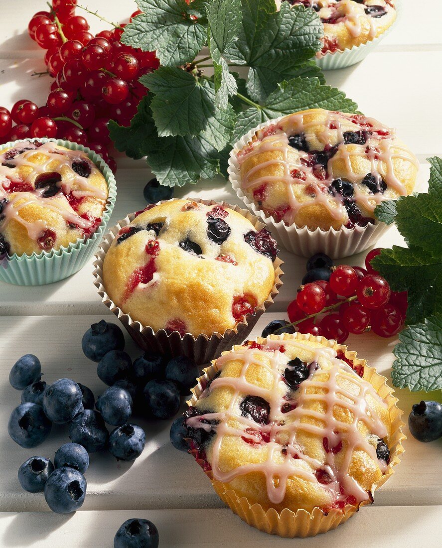 Redcurrant and blueberry muffins in paper cases
