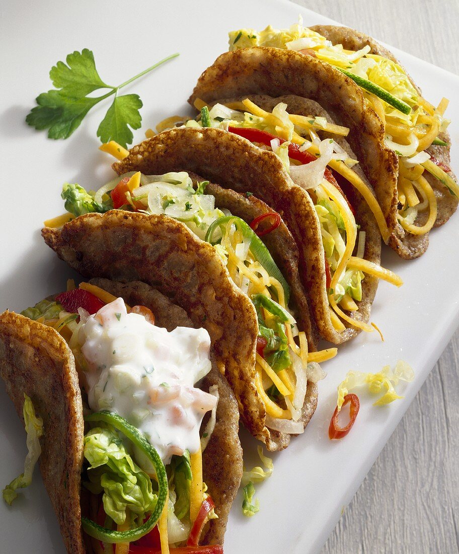 Tacos with vegetable filling and yoghurt sauce