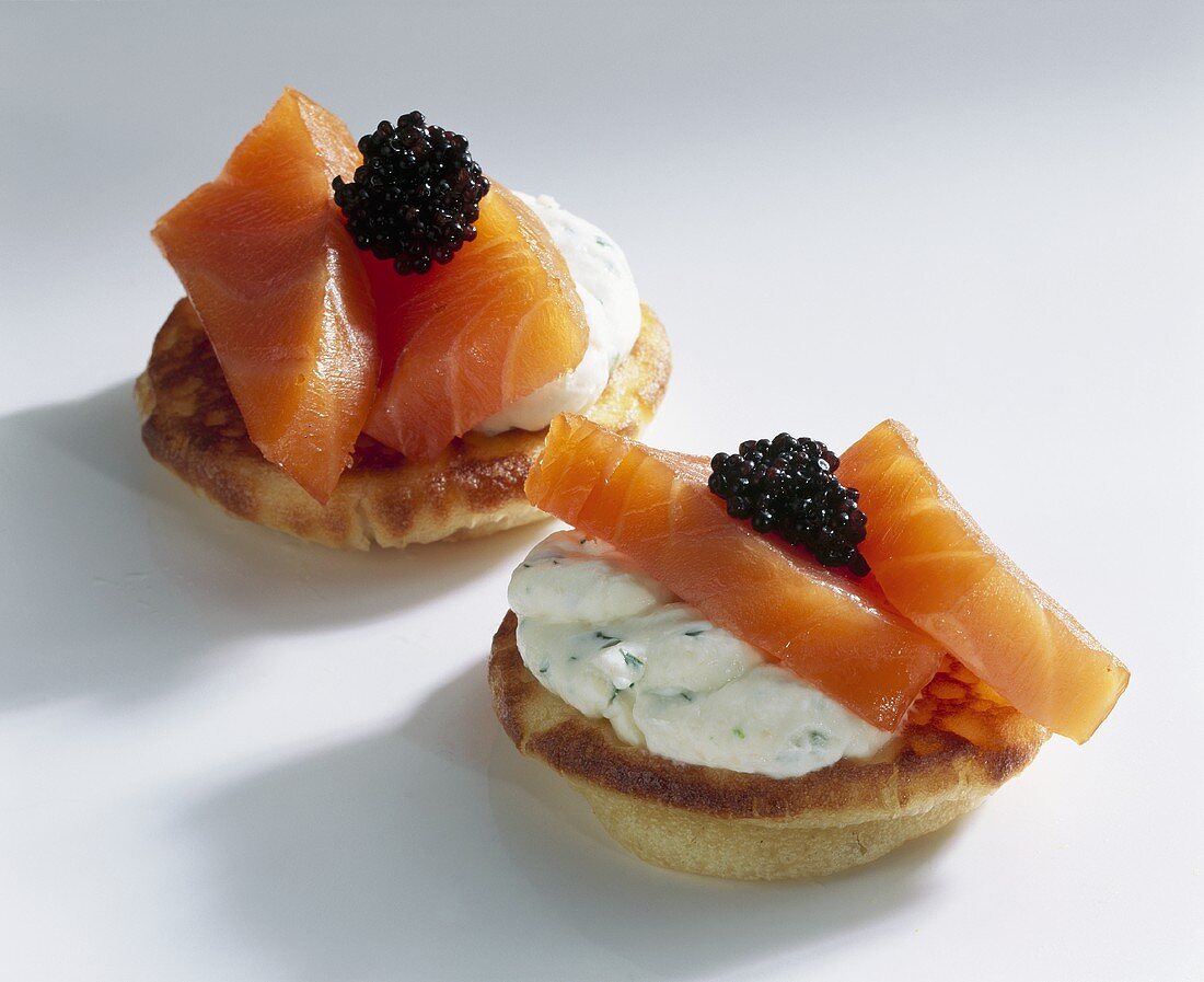 Blinis topped with smoked salmon and caviar