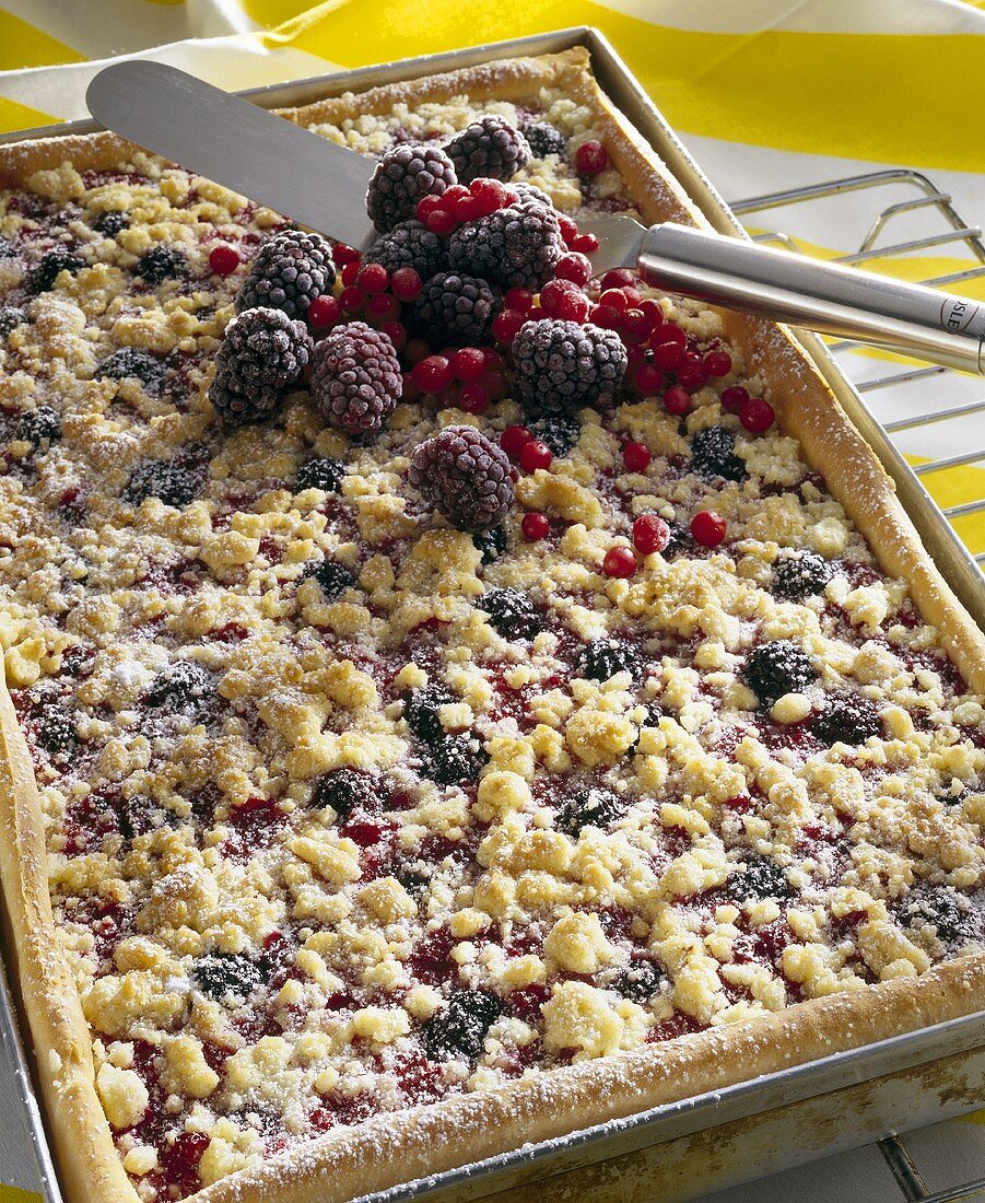 Berry crumble cake on baking tray