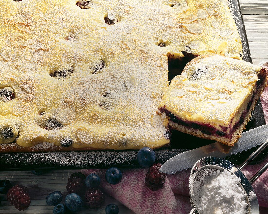 Blackberry and blueberry cake on baking tray