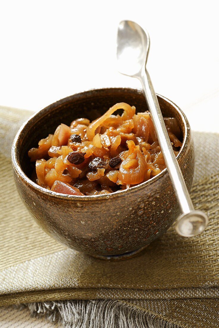 Onion chutney in bowl with spoon