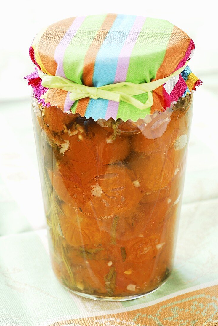 Tomato confit with rosemary in jar