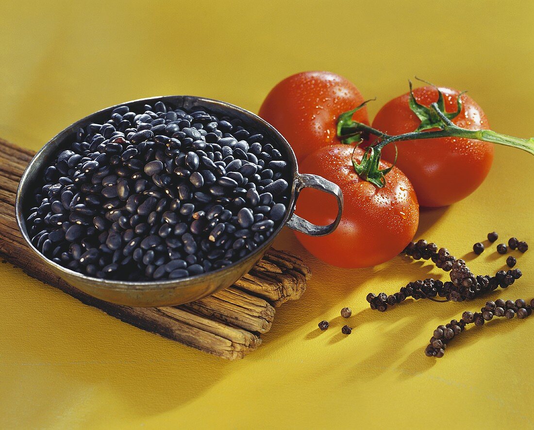 Black beans, tomatoes and bunches of pepper