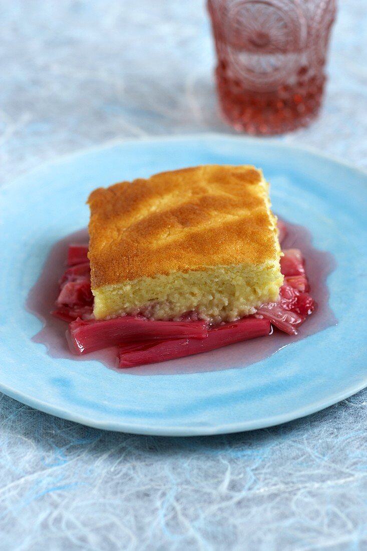 Piece of cake on rhubarb compote
