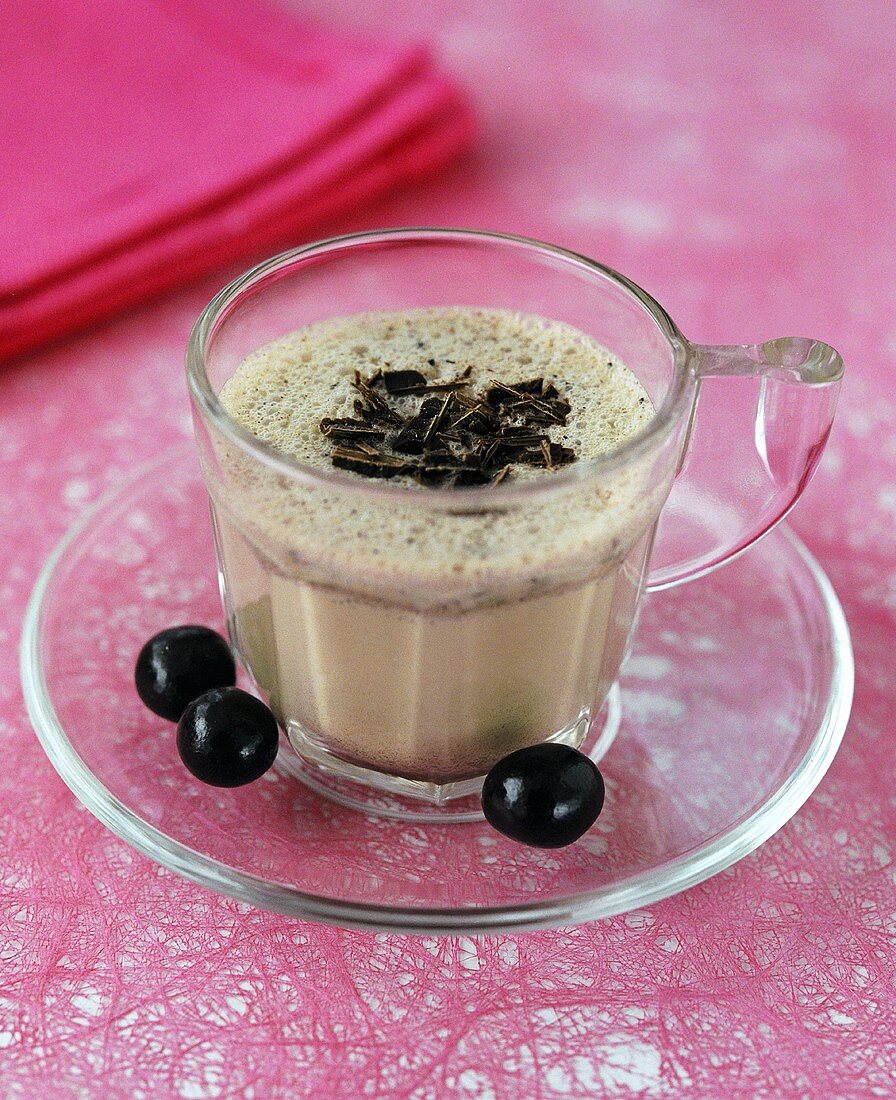 Chocolate and blueberry crème in glass cup
