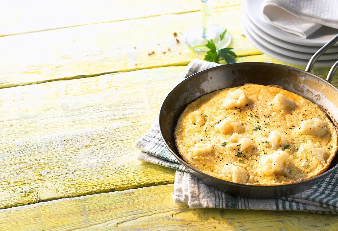 Cauliflower omelette in frying pan