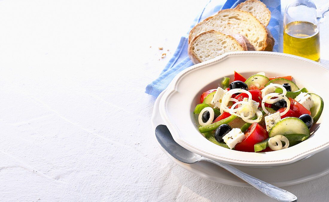 Greek peasant's salad, white bread and olive oil