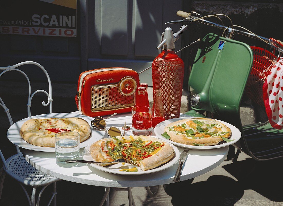 Bistro Table with 3 Pizzas