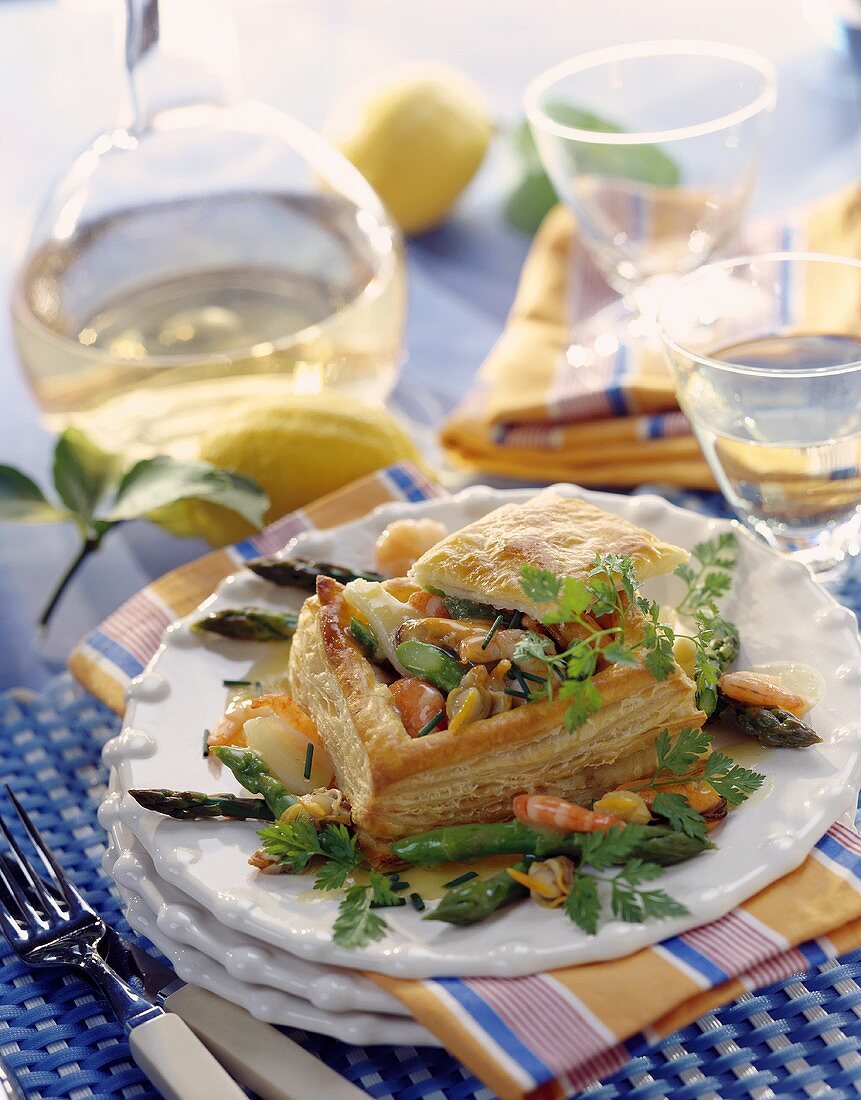 Puff pastry case filled with seafood and asparagus