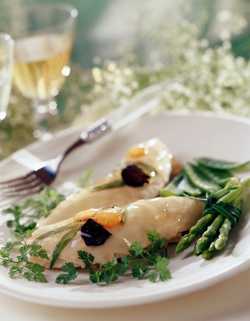 Cold chicken breast in jelly with green asparagus