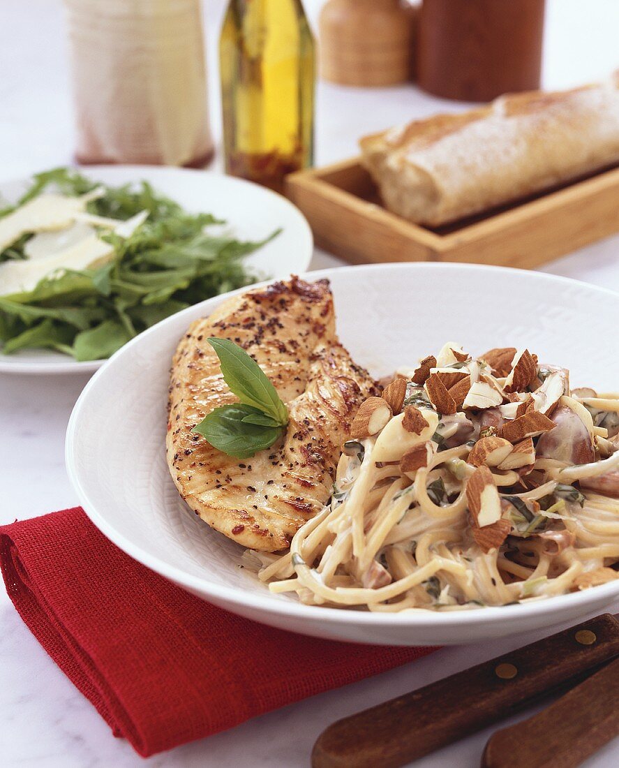 Chicken breast with spaghetti and chopped almonds