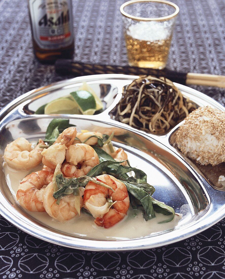 Shrimps in coconut sauce with seaweed salad (Asia)