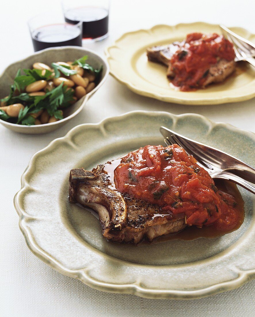 Costolette al pomodoro (Schweinekotelett mit Tomatensauce)