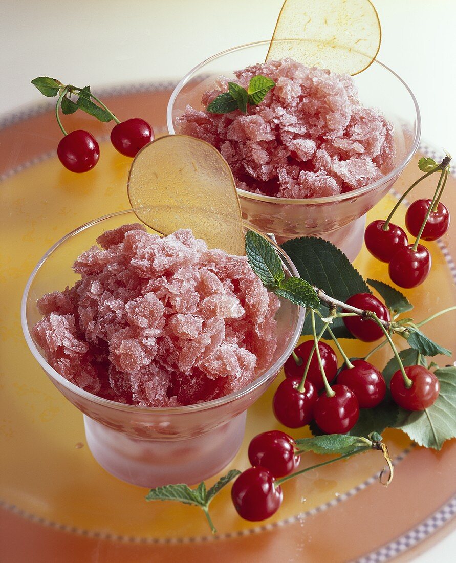 Sour cherry granita with pear crisps in dessert bowls