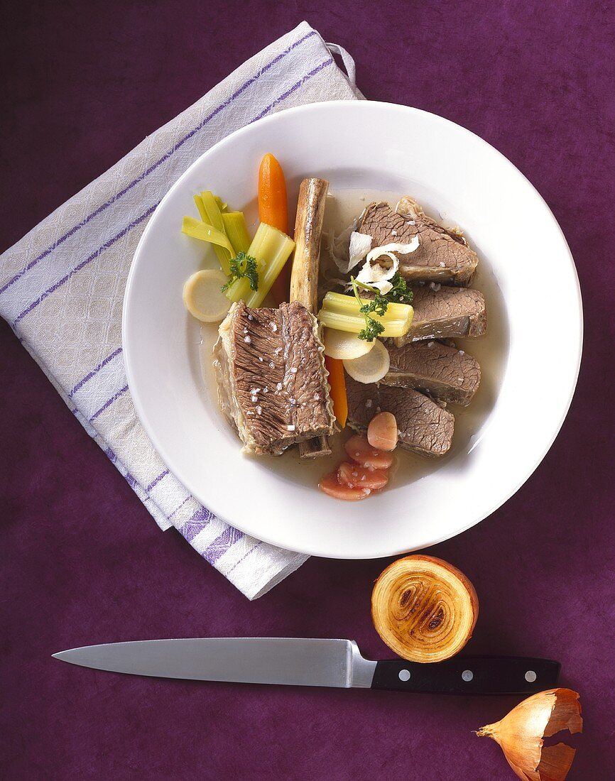 Beef with bone, soup vegetables and horseradish