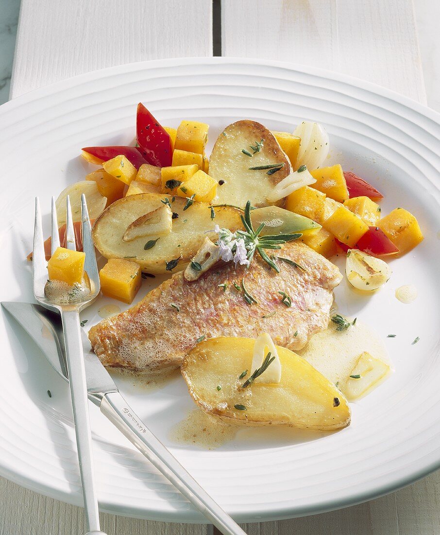 Red mullet fillet with rosemary potatoes, pumpkin & peppers