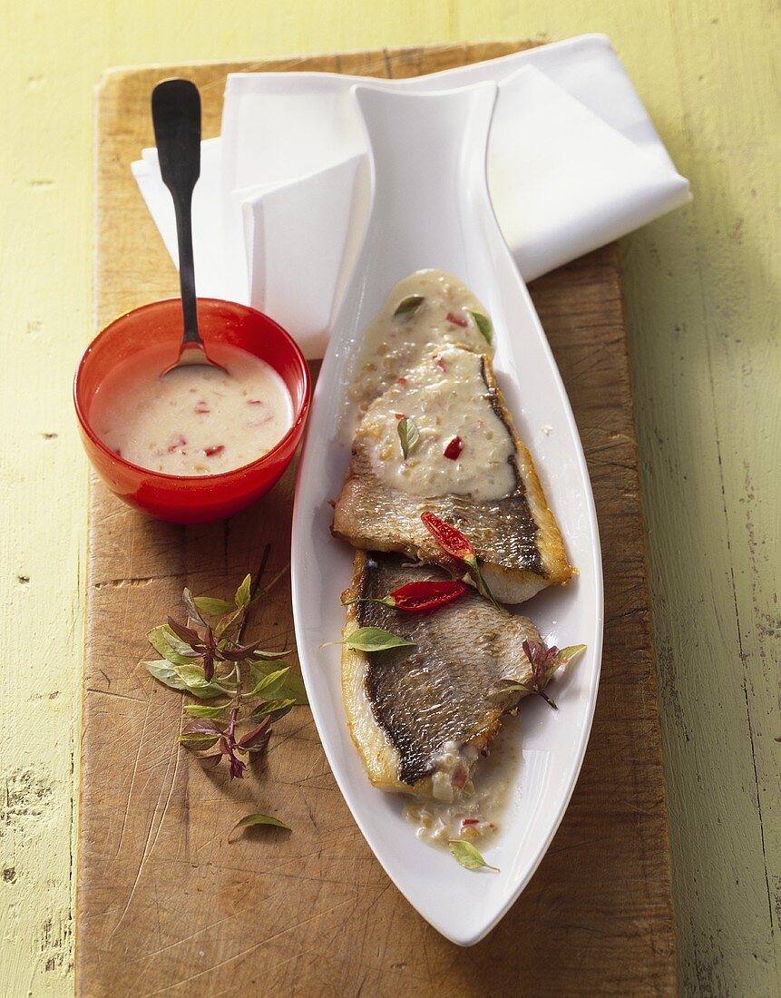 Fried sea bream fillet with coconut sauce