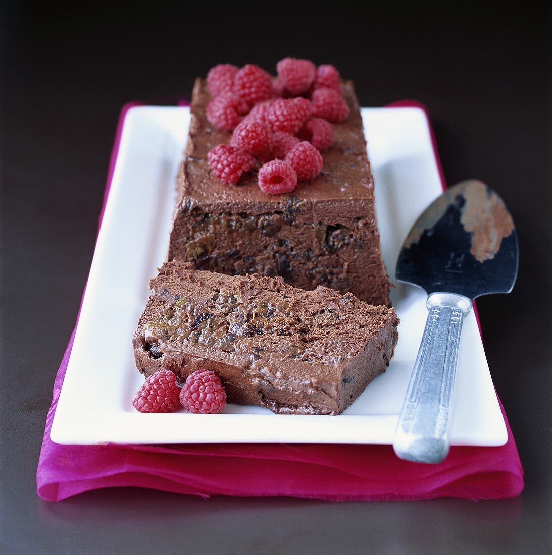 Chocolate mousse cake with rum, raisins and raspberries