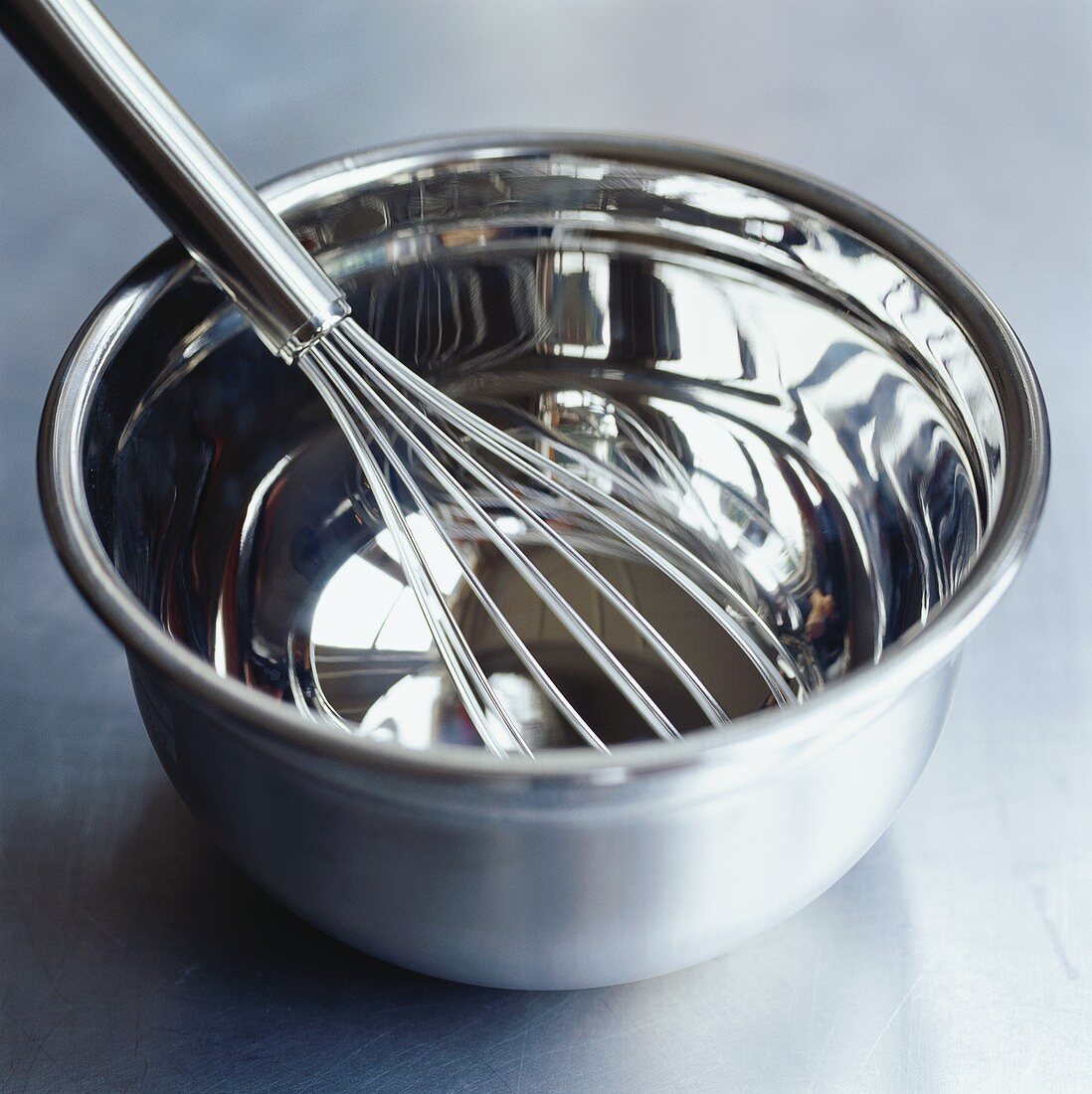 Whisk in stainless steel bowl
