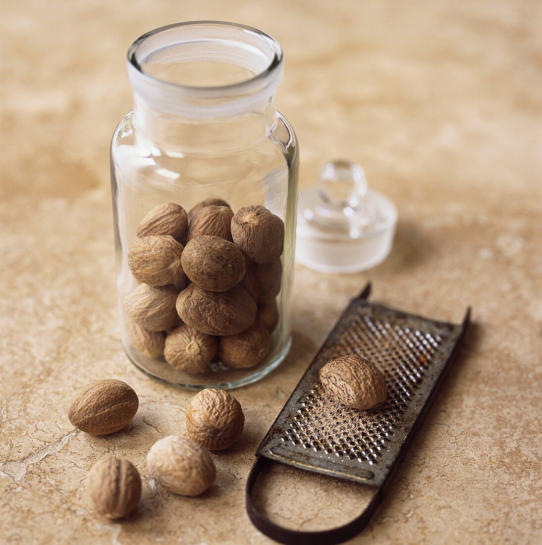 Nutmegs in a jar and on a grater