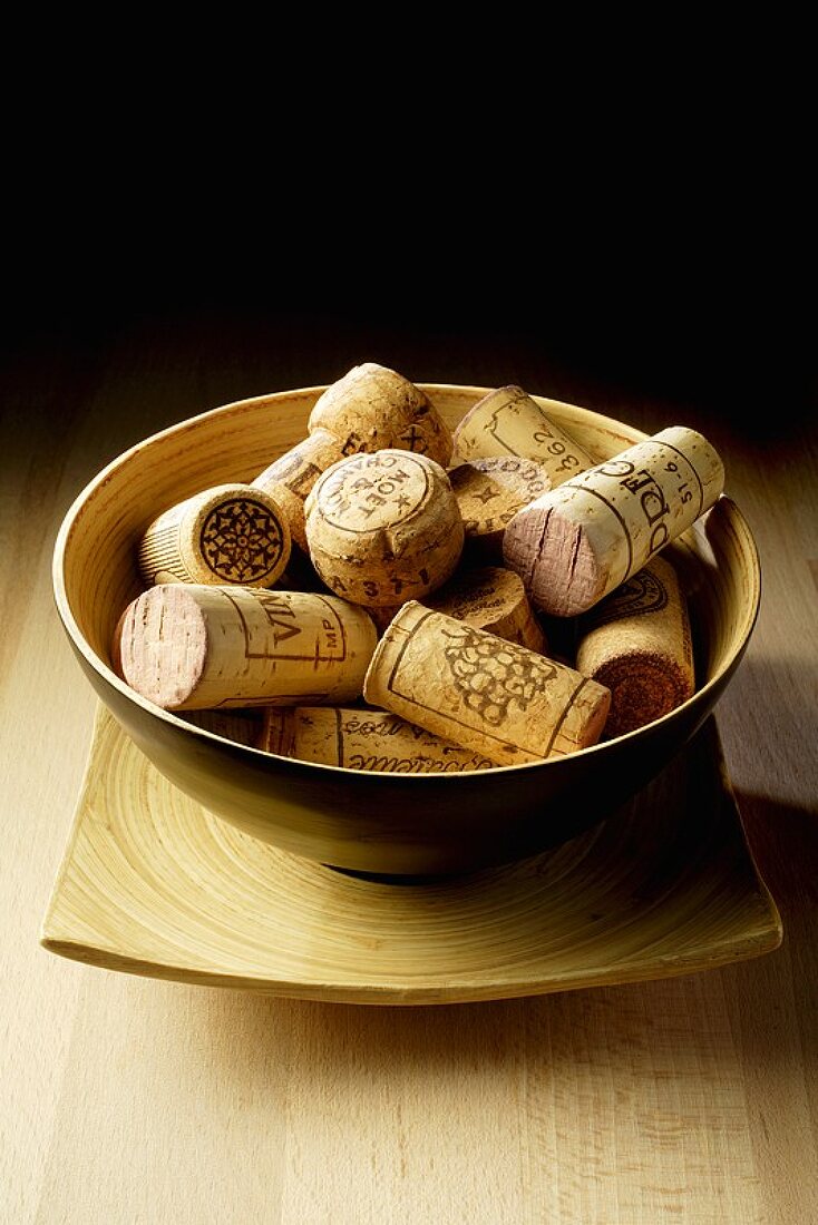 Assorted wine corks in a bowl