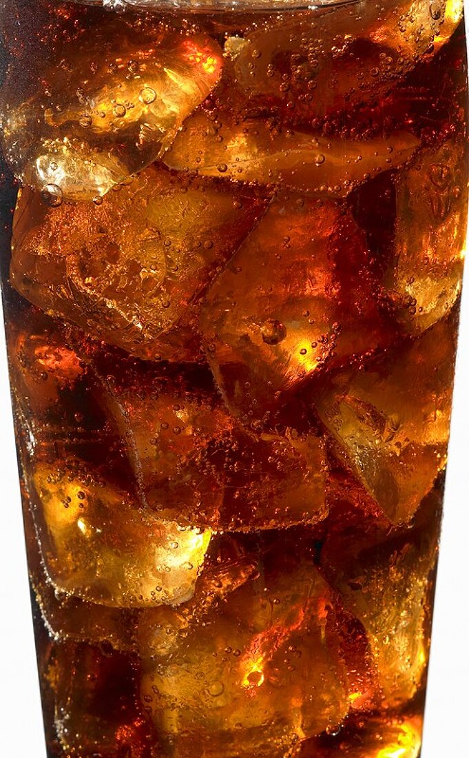 Cola with ice cubes in a glass (detail)