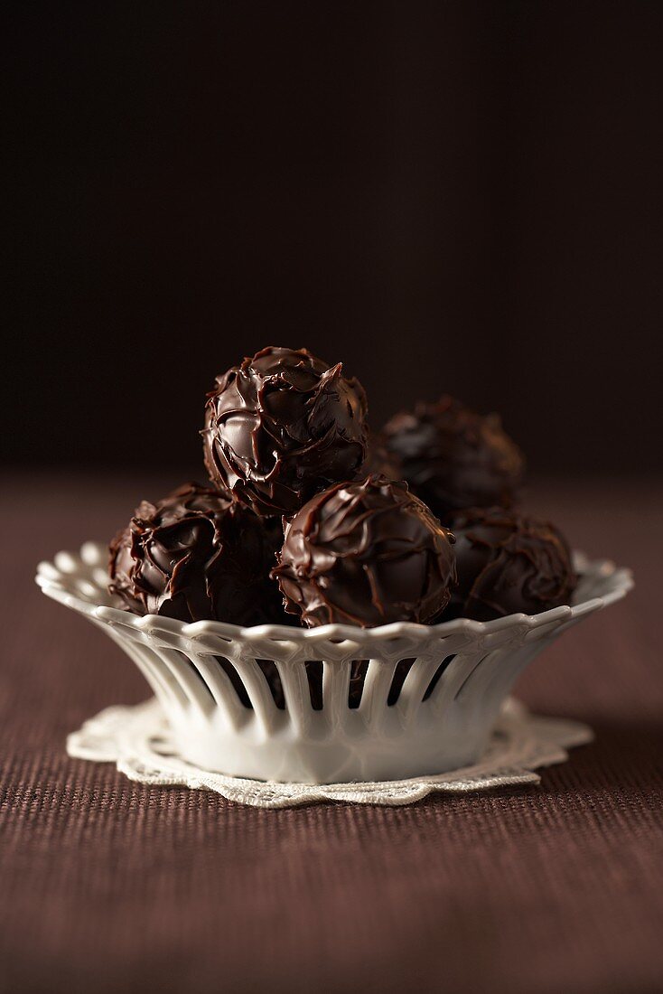 Chocolate truffles in white dish