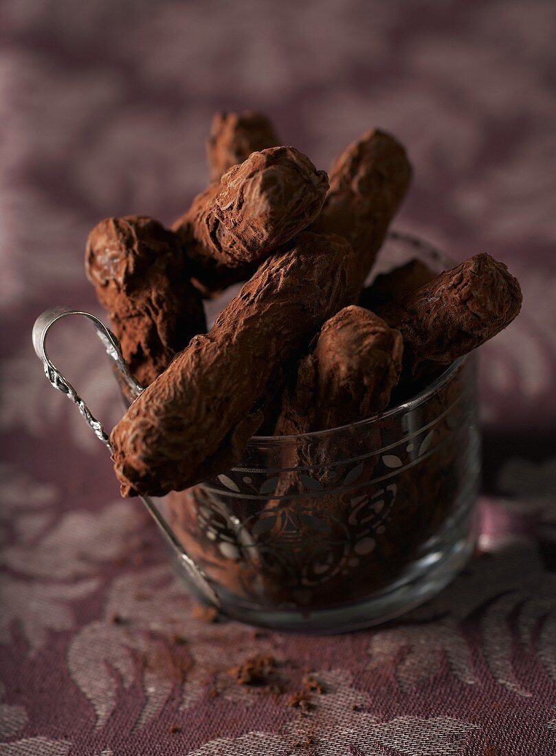 Chocolate truffle sticks with cocoa powder