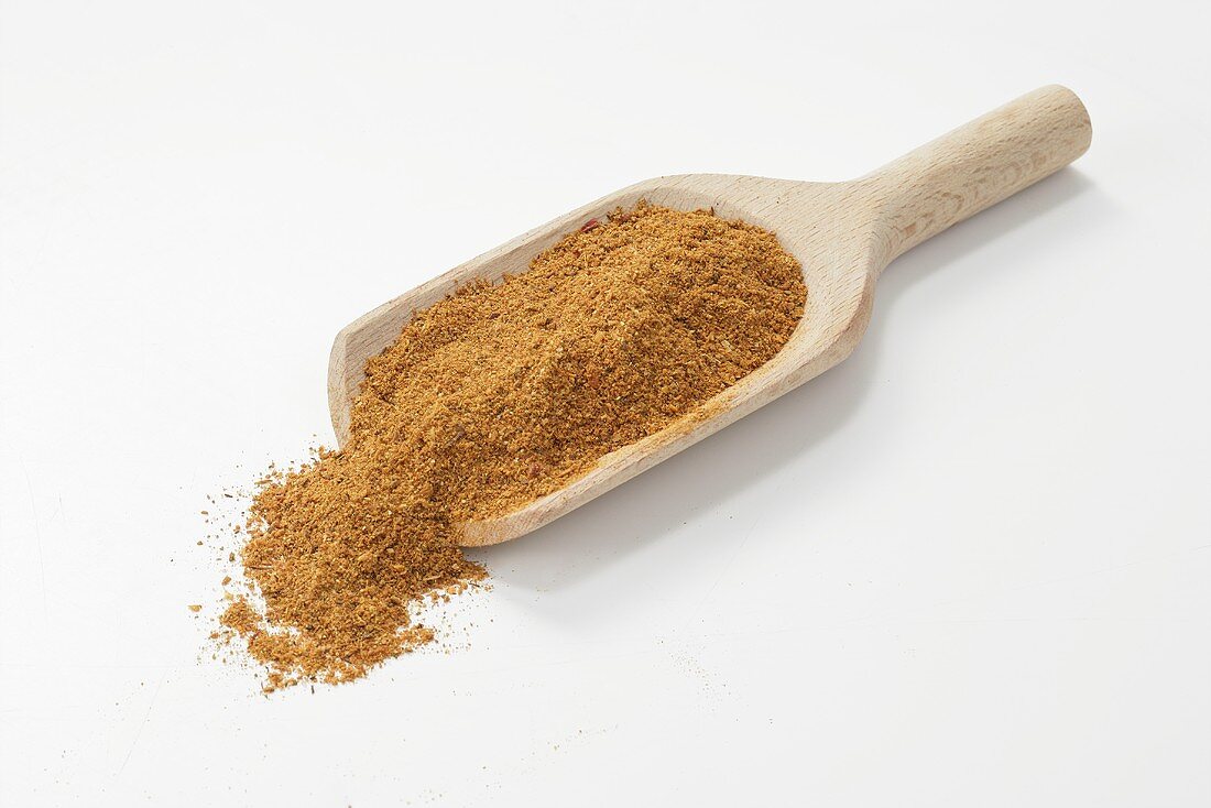 Tandoori masala spice mixture in wooden scoop