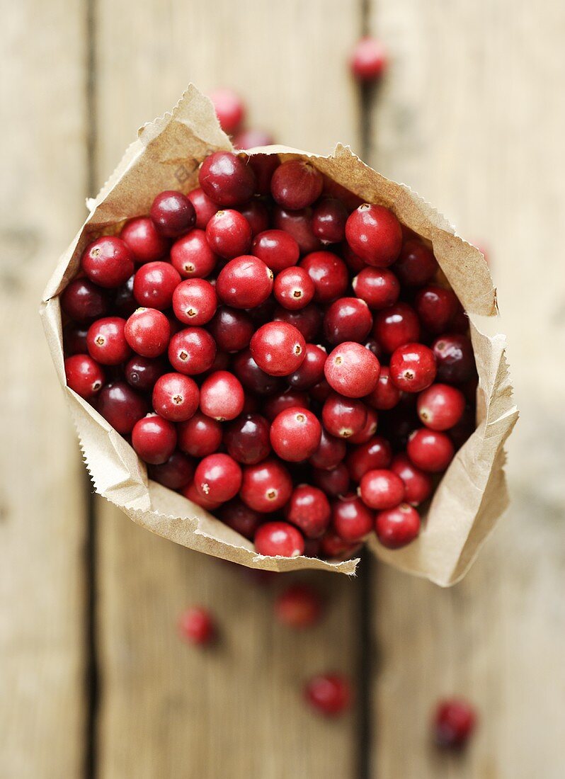 Cranberries in paper bag (overhead view)