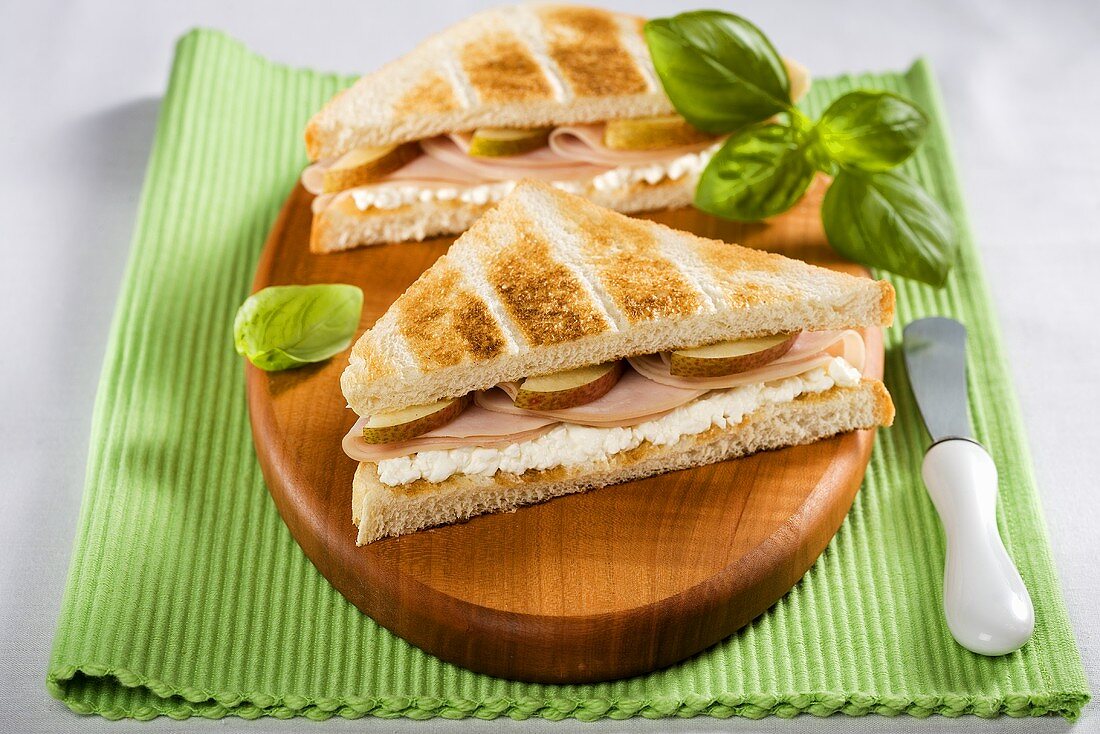 Toasted turkey ham and pear sandwiches