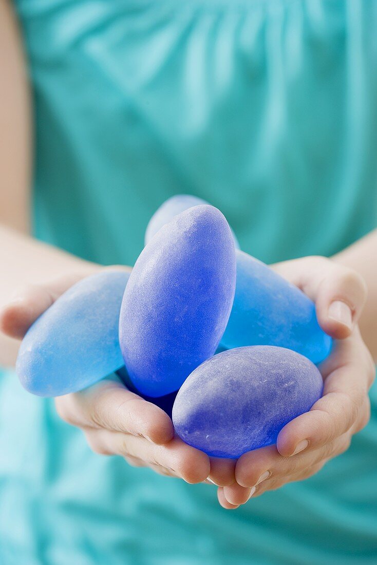 Woman holding blue stones