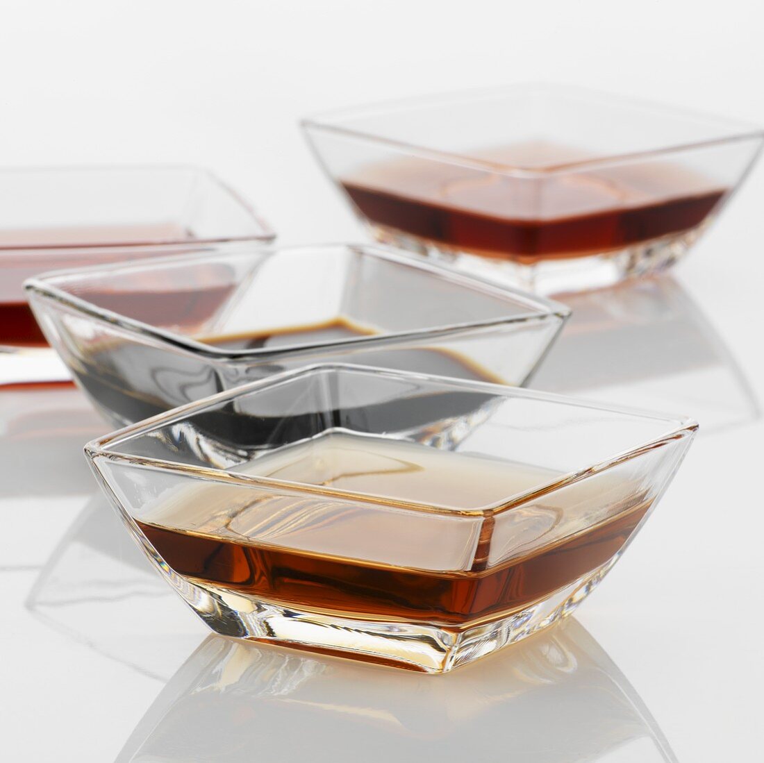 Various types of vinegar in glass dishes