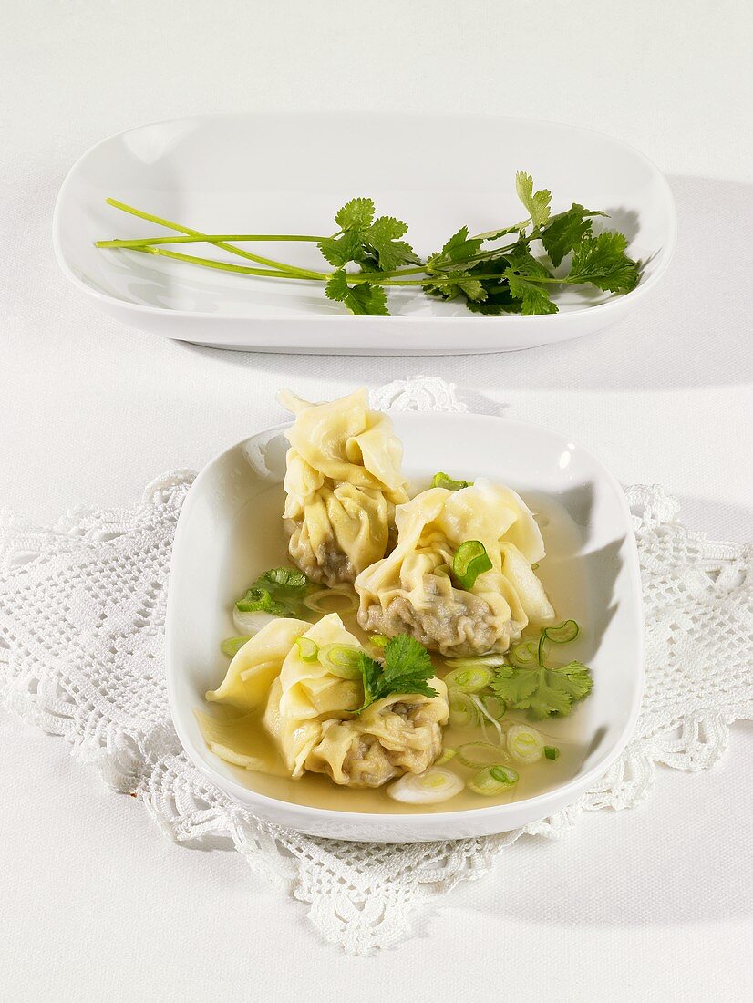 Filled pasta purses with spring onions & coriander leaves