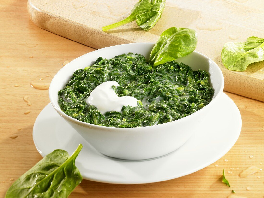 Creamed spinach with a spoonful of sour cream