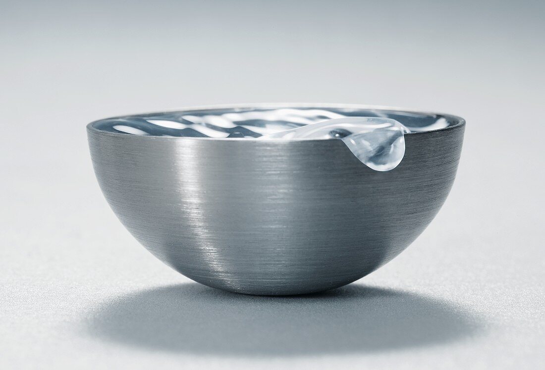 Water wave in metal bowl