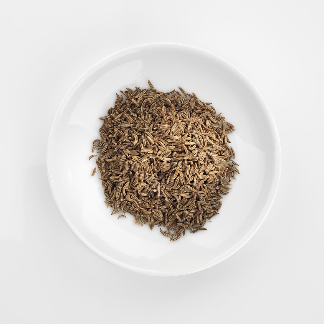 Caraway in white dish