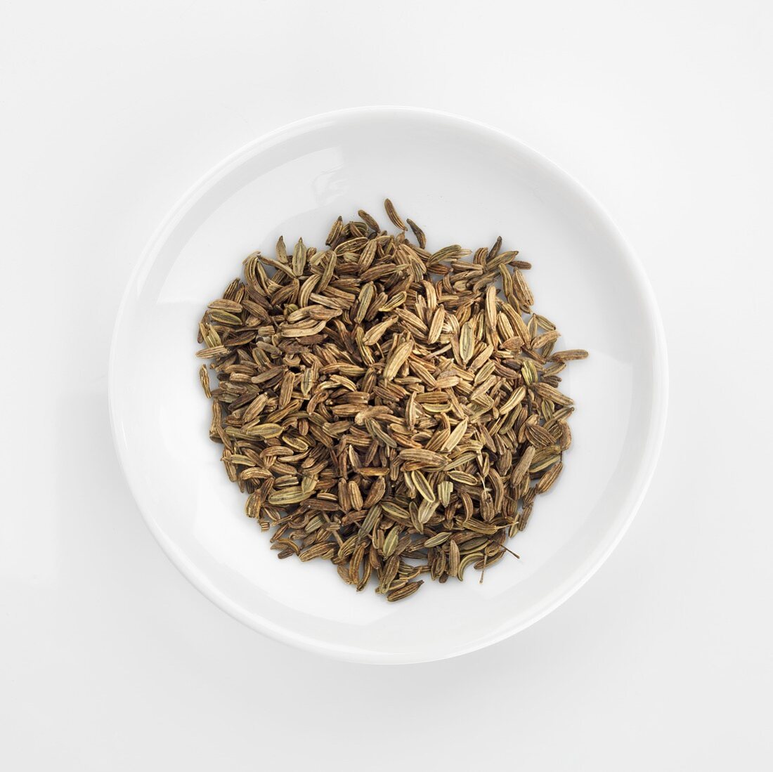 Fennel seeds in white dish