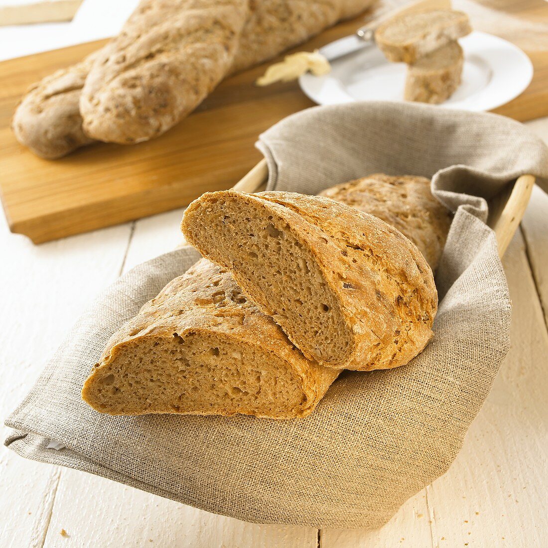 Onion baguettes in bread basket and on chopping board