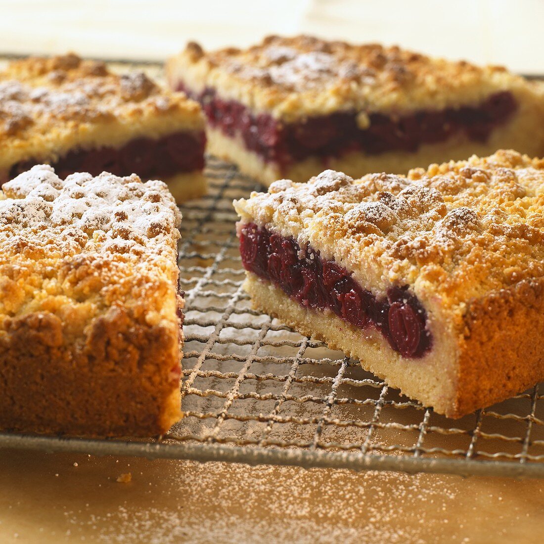 Cherry crumble cake, cut into pieces