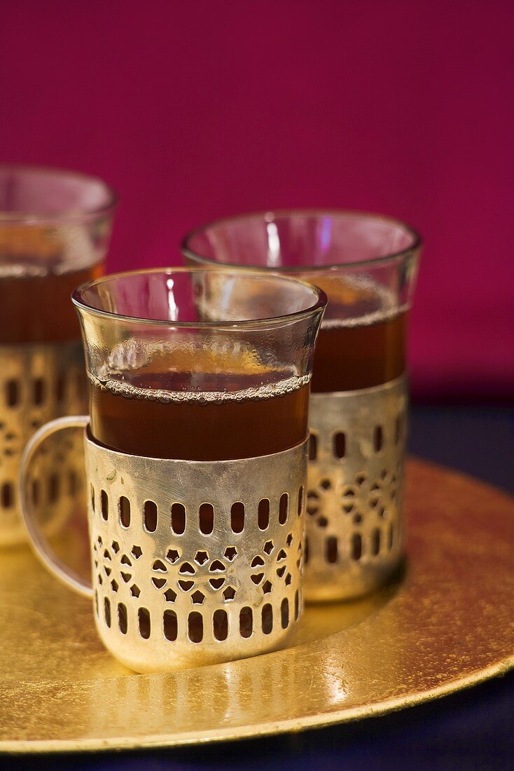 Three glasses of black tea