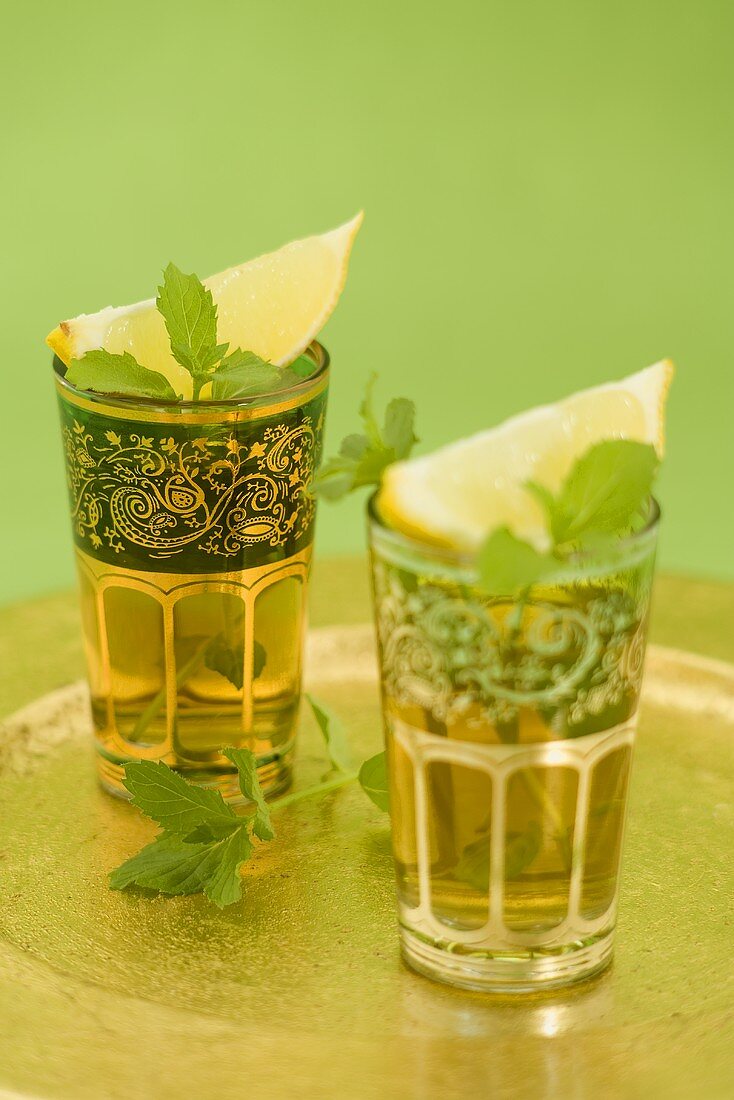 Two glasses of mint tea with lemon