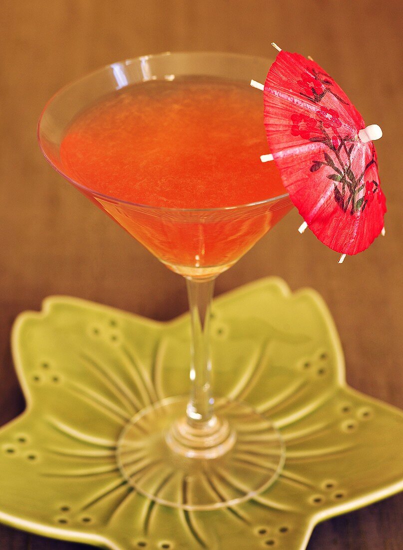 Rhubarb drink with cocktail umbrella