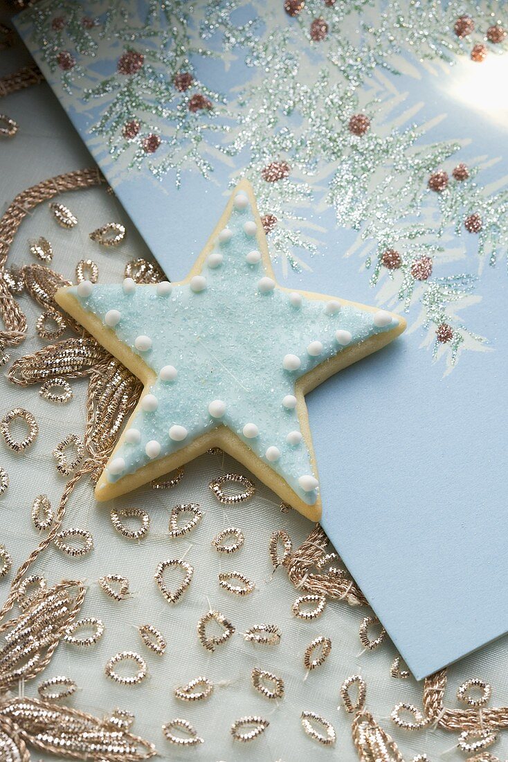 Blue star biscuit on Christmas card