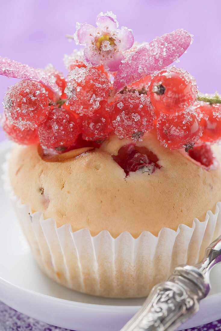 Redcurrant muffin with sugared redcurrants and flowers