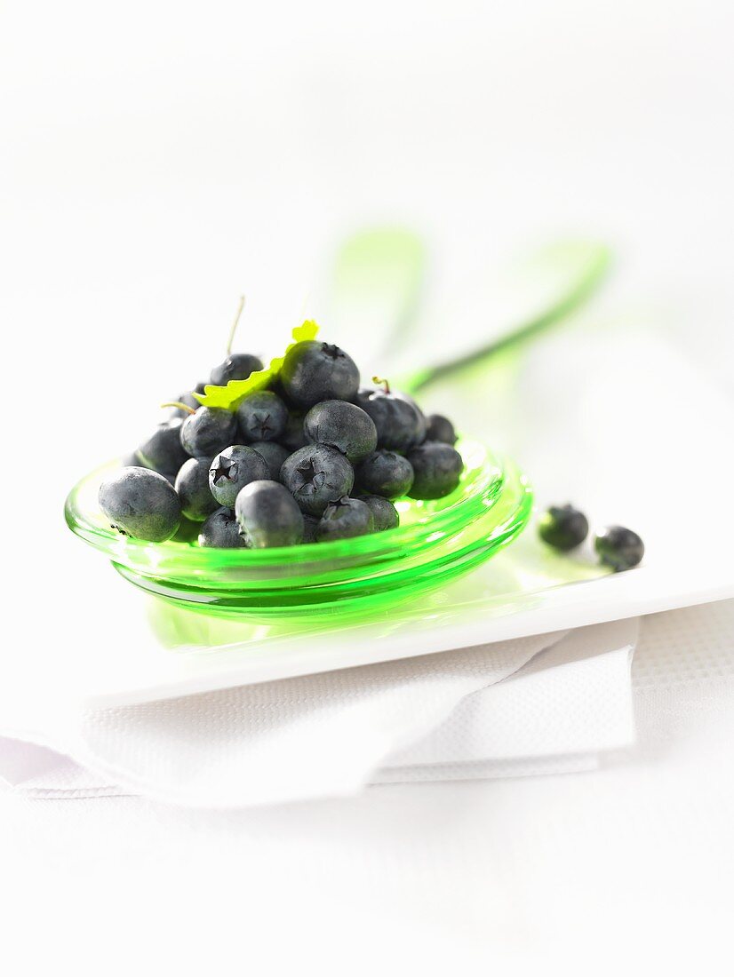 Fresh blueberries on salad servers