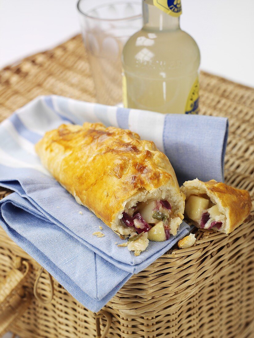 Cornish pasty on picnic basket (England)