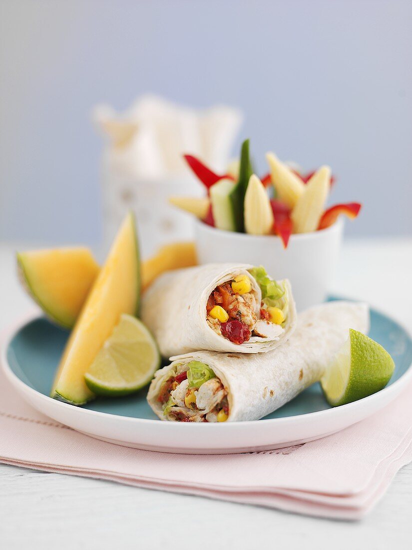 Prawn and vegetable wraps with melon wedges for lunch